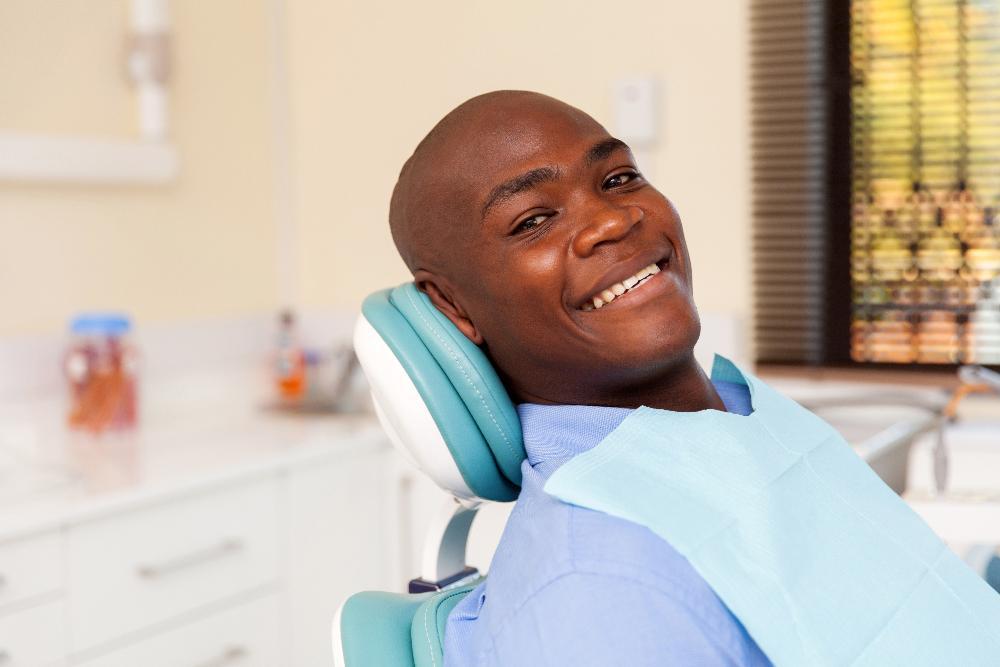 Man getting a dental exam in Gaithersburg, MD