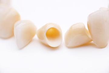 dental crown caps on a surface