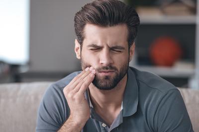 Man experiencing a toothache