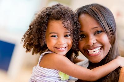 A mother and daughter hugging