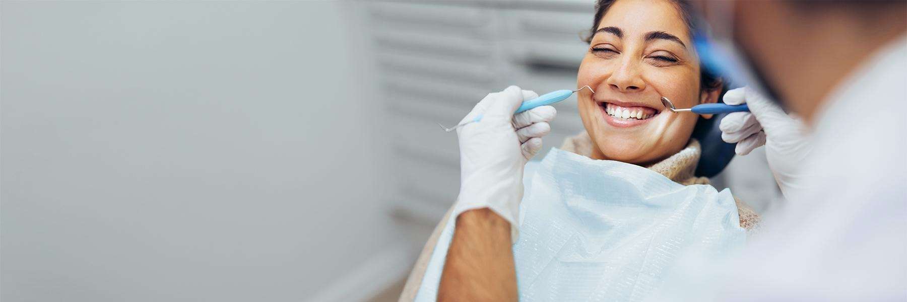 Woman smiling at the dentist's office | General Dentist Gaithersburg