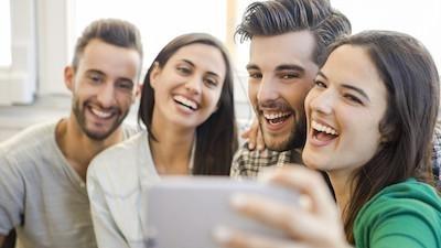 Group of friends smiling for a selfie