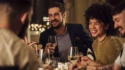 Friends eating holiday dinner