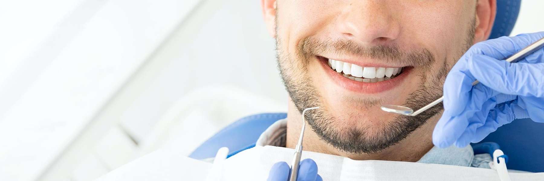 man getting a dental exam in Gaithersburg, MD